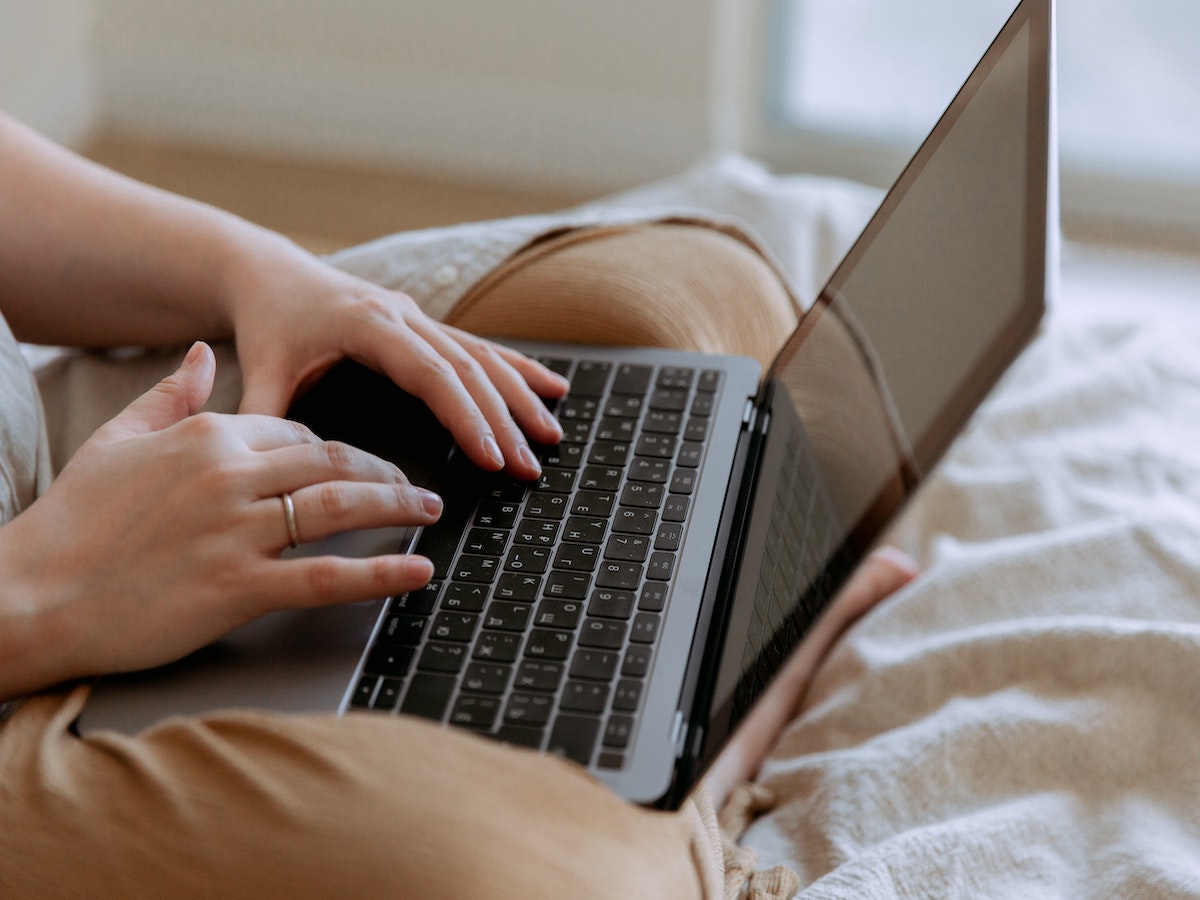 a person using a laptop to develop and improve outreach strategy